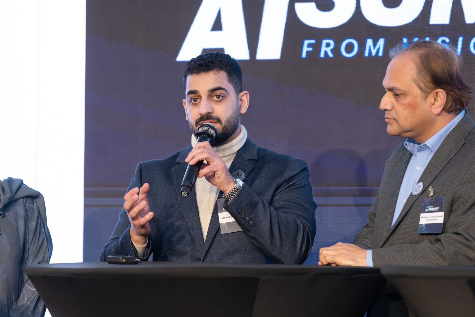 Ahmed Salama speaking during an AI panel discussion